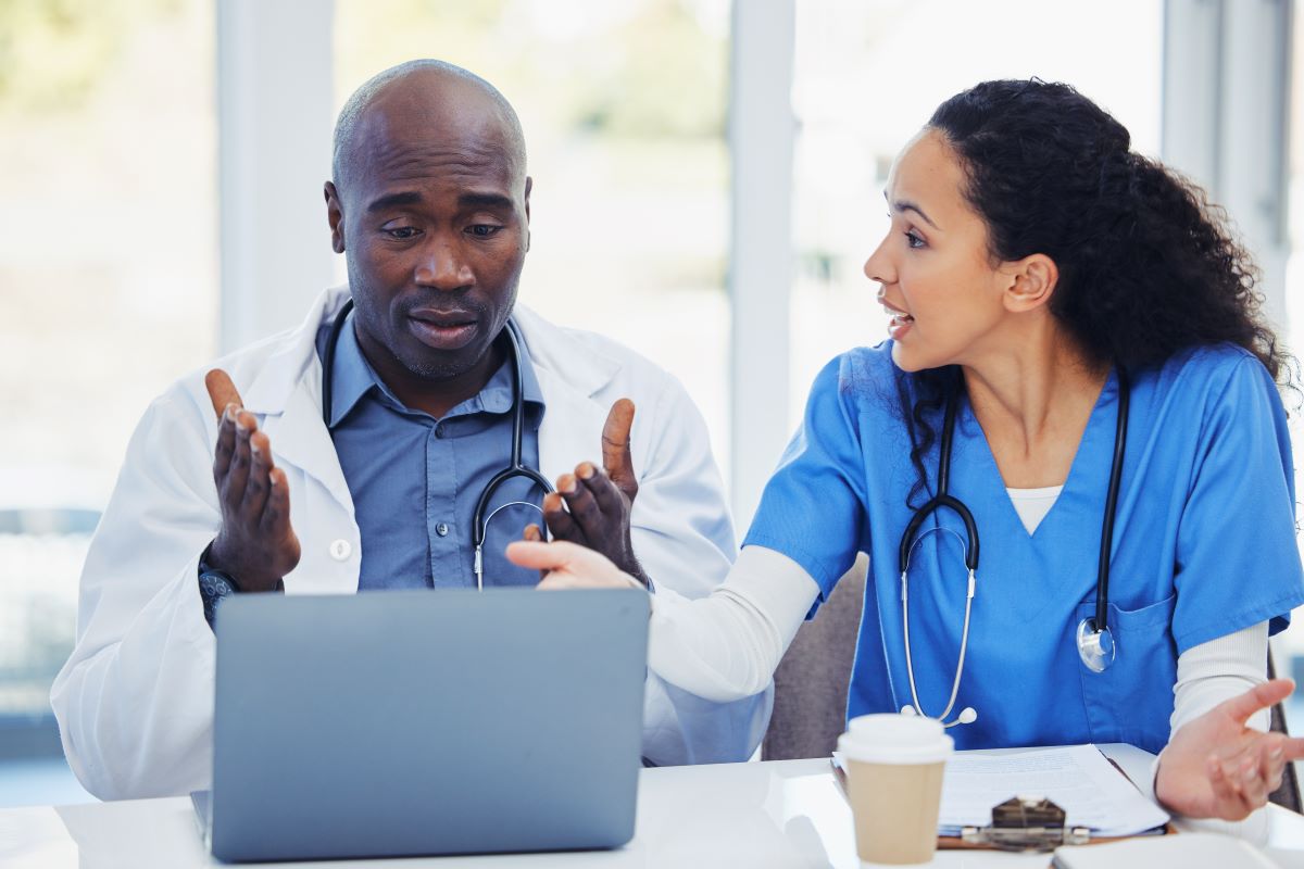 Miscommunication in healthcare can lead to disputes, like the one depicted in this picture of a nurse and doctor arguing.