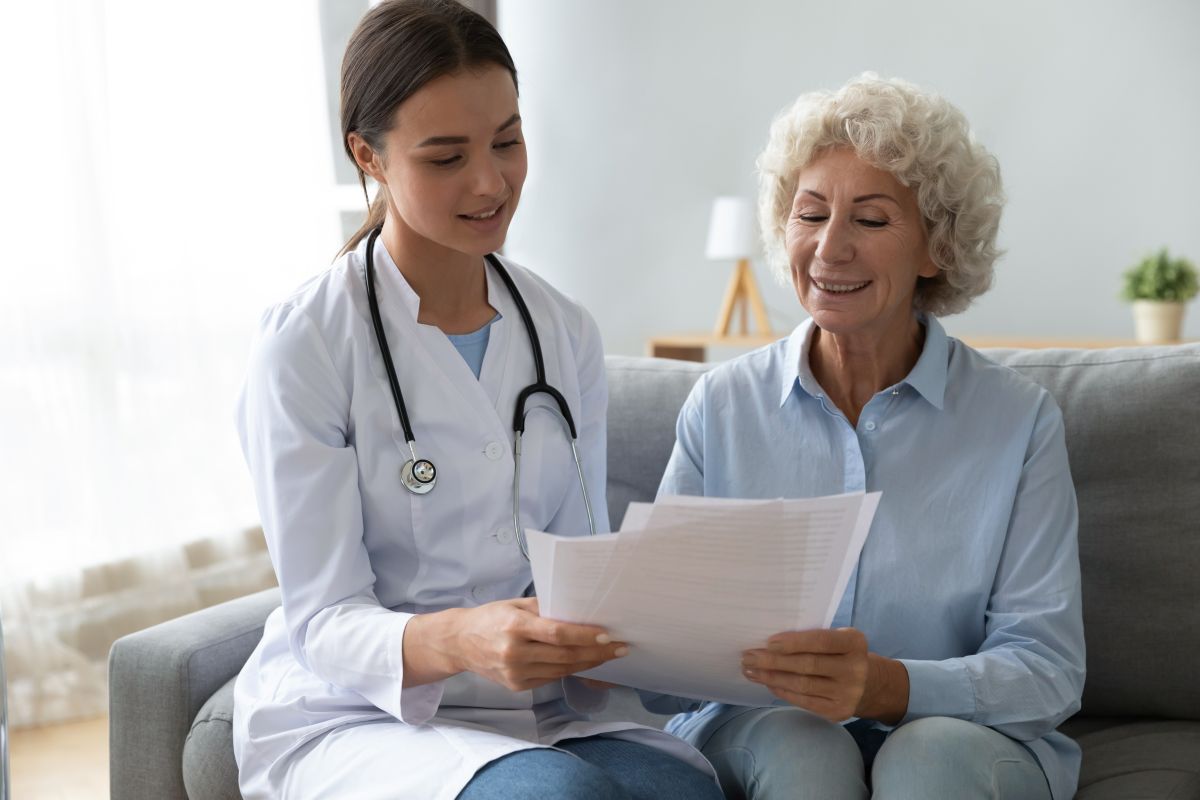 A nurse practitioner meets with one of her patients.