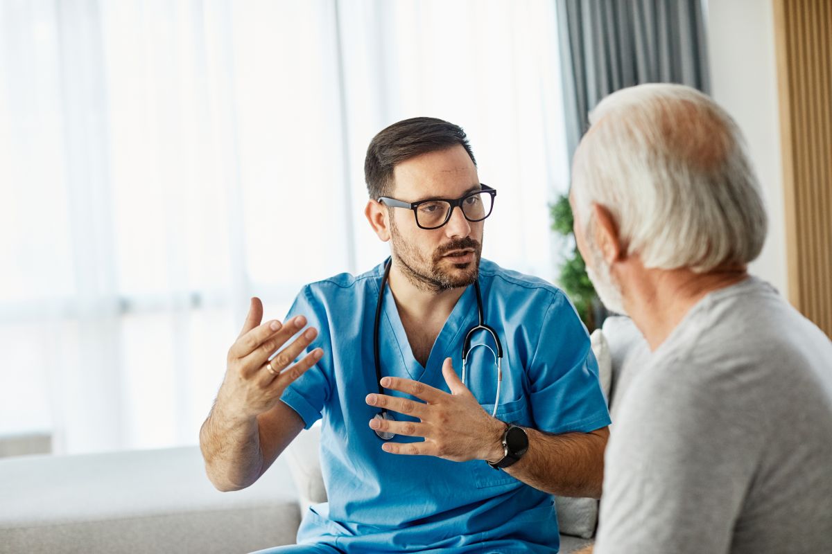 A nurse, who's aligned with the National Patient Safety Goals, discusses a treatment option with his patient.