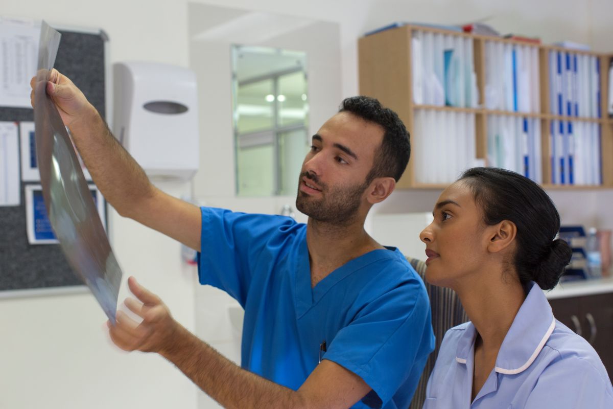New Jersey nurses look at an x-ray together.