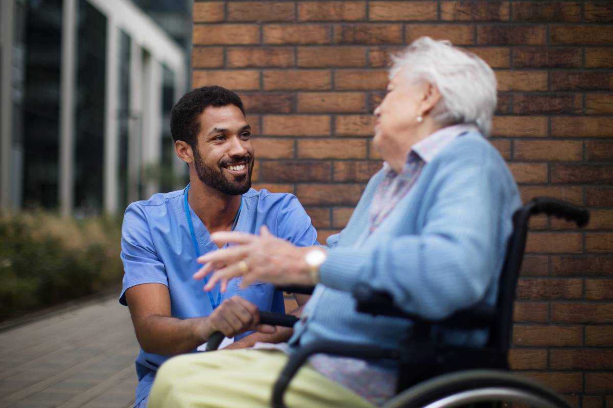 A nurse uses their NIH stroke certification skills to assist a patient.