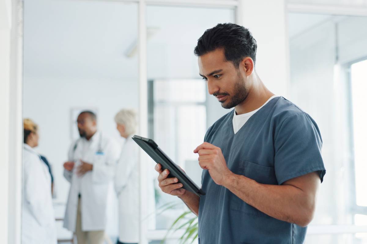 A nurse works on his NJ nursing license renewal process.
