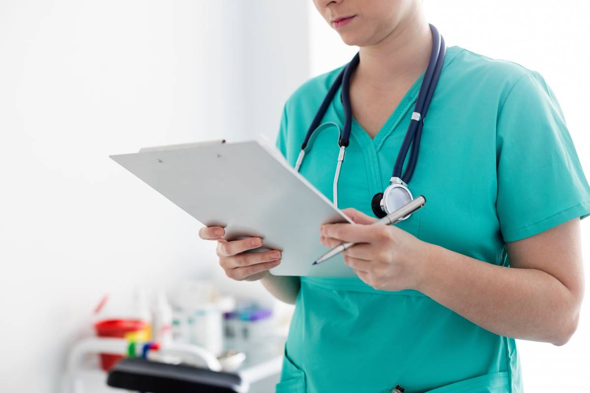 A healthcare professional uses their nurse accessories at work.