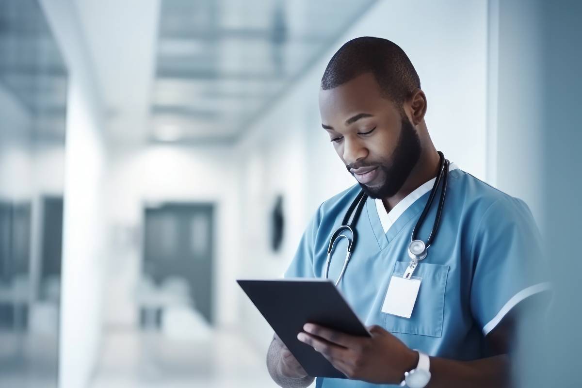 A nurse works on his nurse practitioner cover letter.