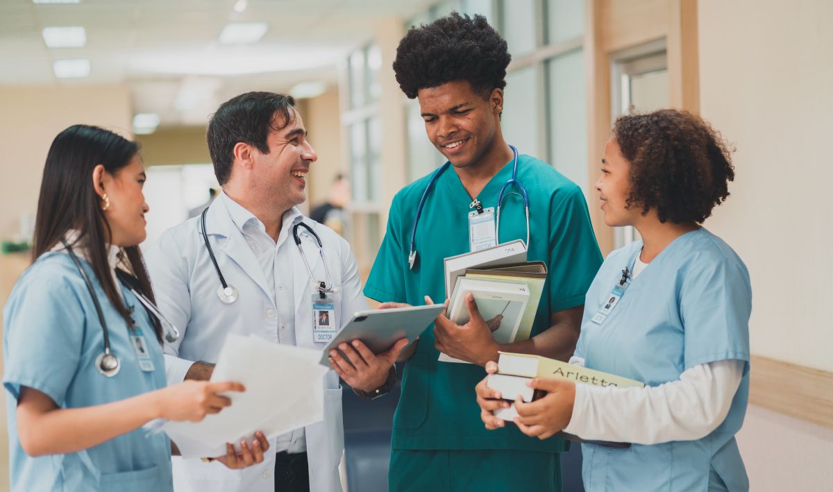 Nurses speaking with clinical team in medical facility