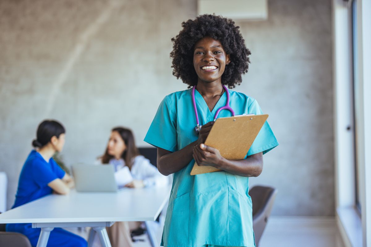 An occupational health nurse leads a discussion with healthcare staff.
