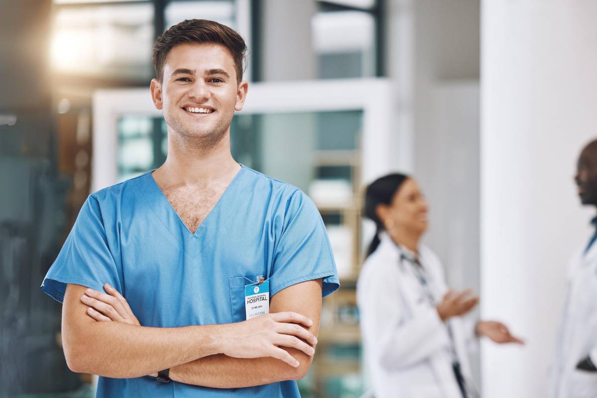 A nurse stands and contemplates his PACU nurse cover letter skills.