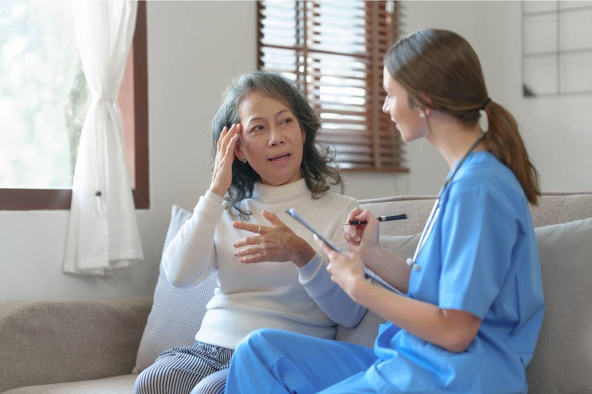 A pain management nurse practitioner meets with a patient to discuss their migraines.