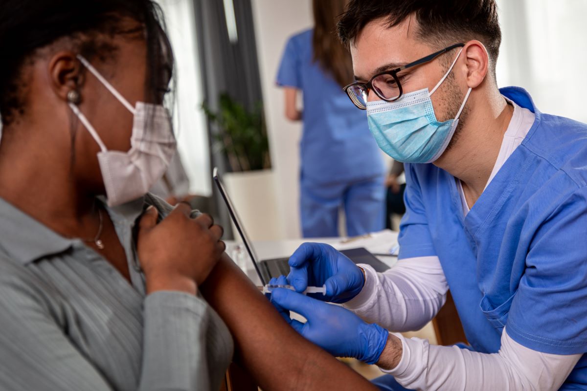 A nurse who is committed to great patient outcomes, administering an injection.