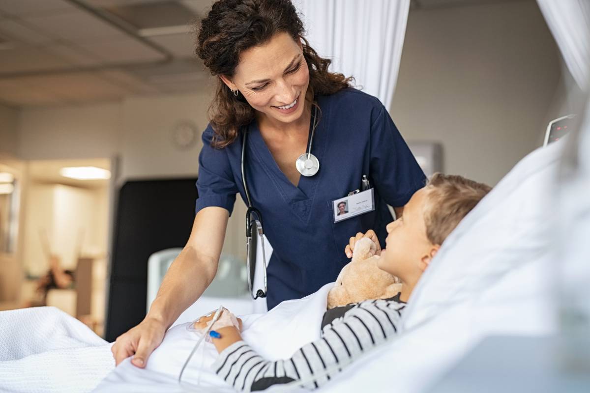 A nurse earns her pediatric nurse salary at work.