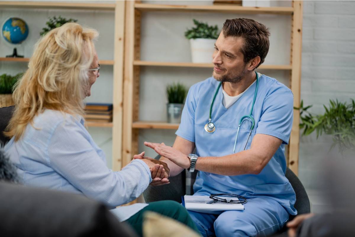 A nurse practitioner with PMHNP-BC certification greets a patient in a substance abuse clinic.