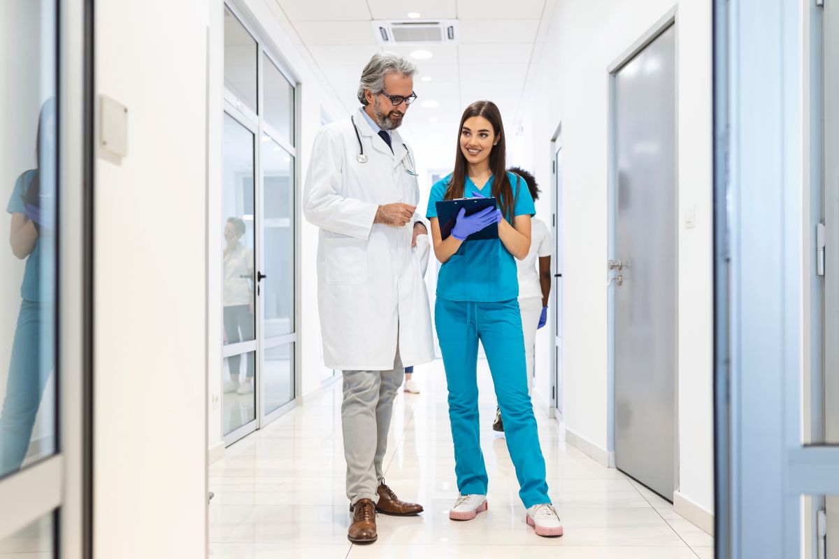 A nurse manager meets with a physician.