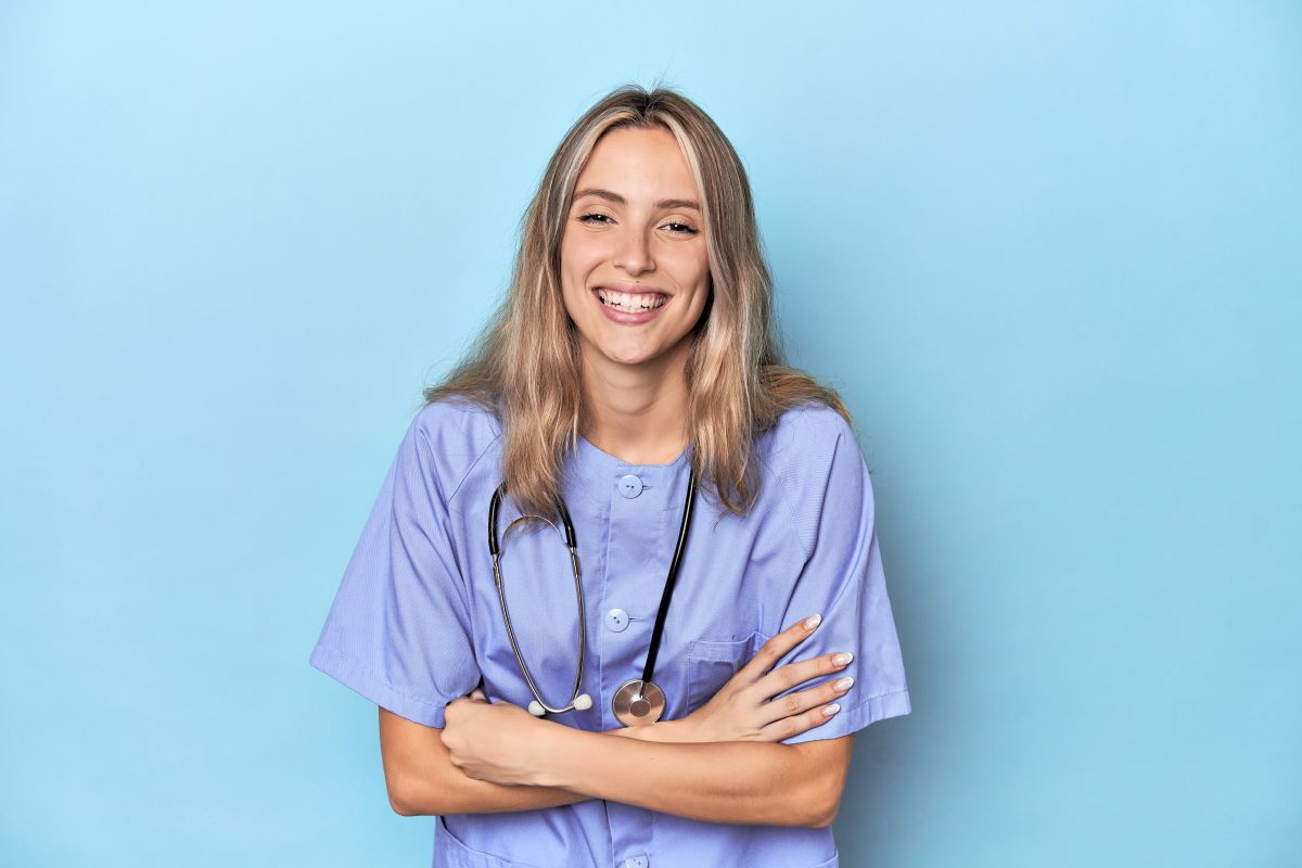 A nurse candidate smiles as she answers RN behavioral interview questions.