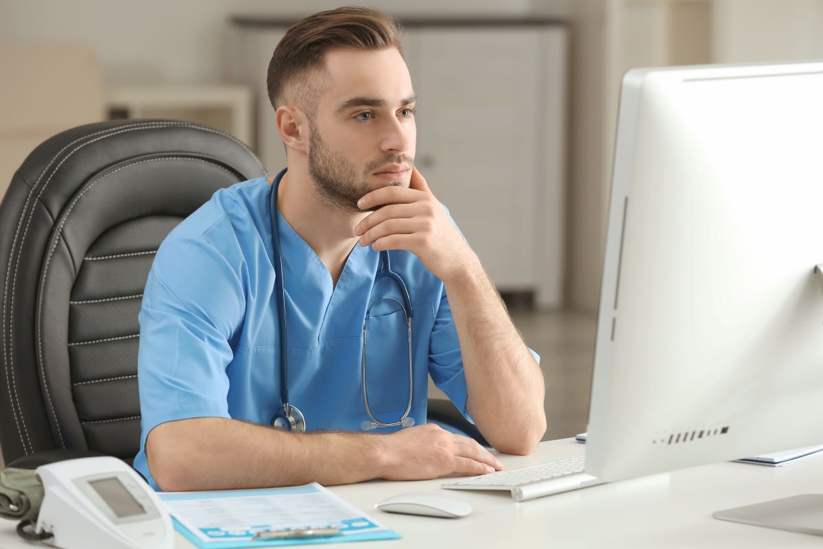 A nurse at a senior living facility checks the CRM to keep in touch with families.
