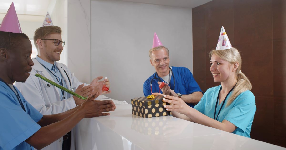 A nurse receives a staff appreciation gift.