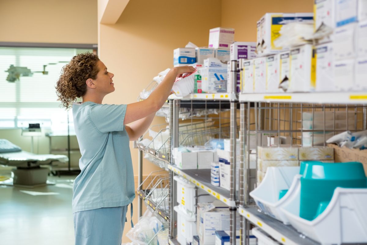 A medical facility employee checks for supplies.