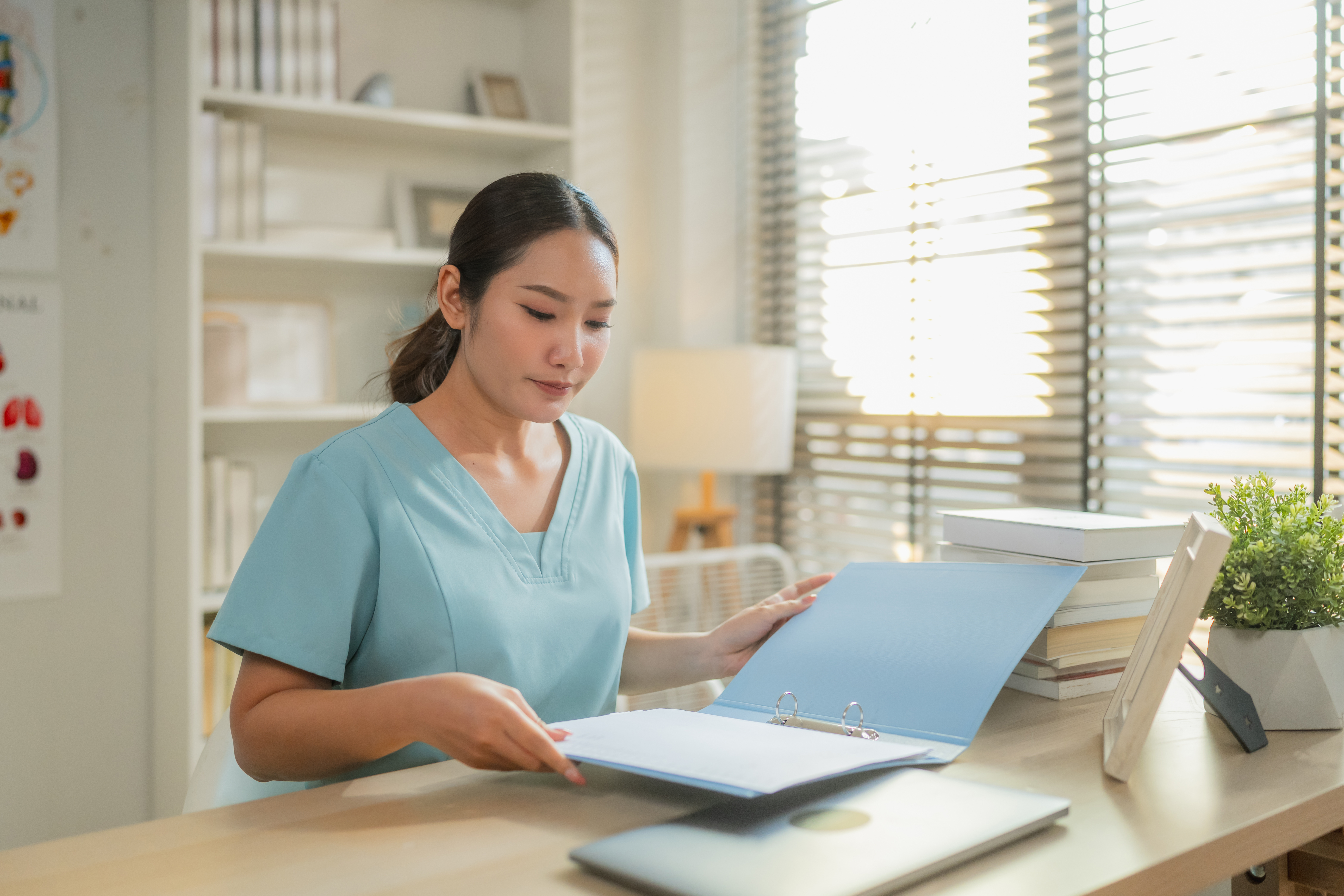 Florida CNA providing certification to hiring manager in an office
