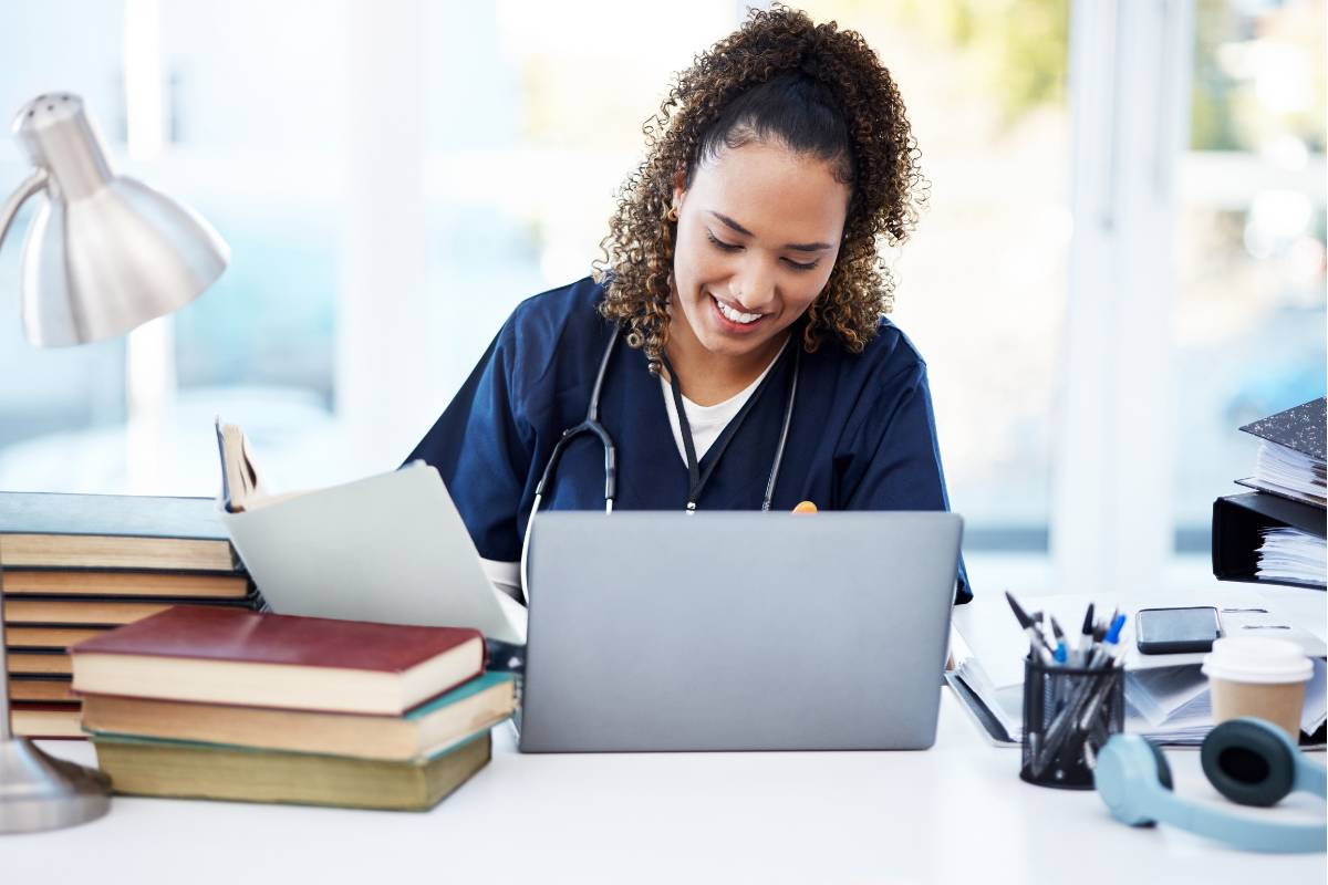A nurse works on the Wisconsin nursing license renewal process.